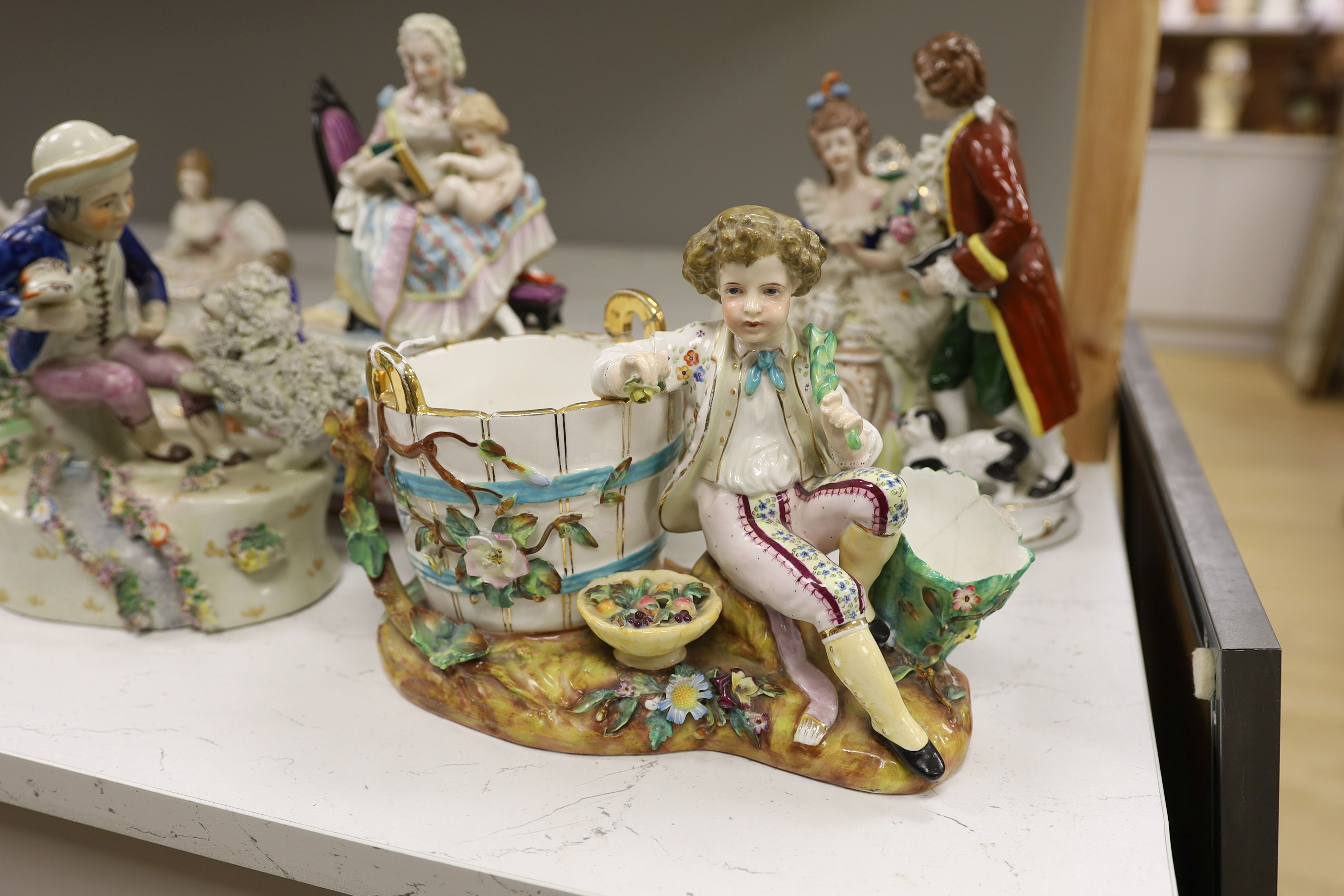 A John Bevington figural bowl, and four Continental porcelain groups and a Staffordshire style group, tallest 27cm